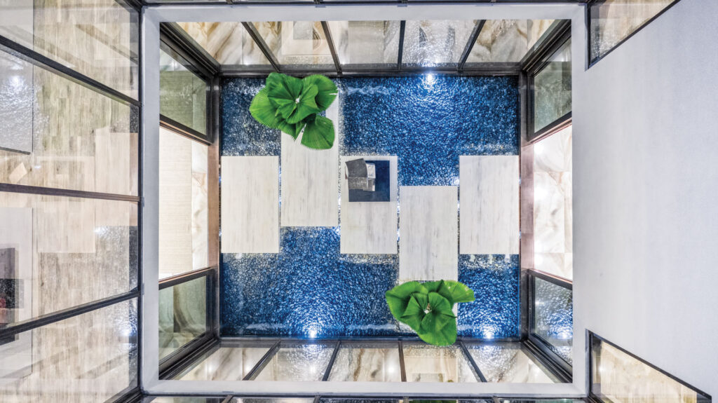 Aerial view of an indoor pool with walkway